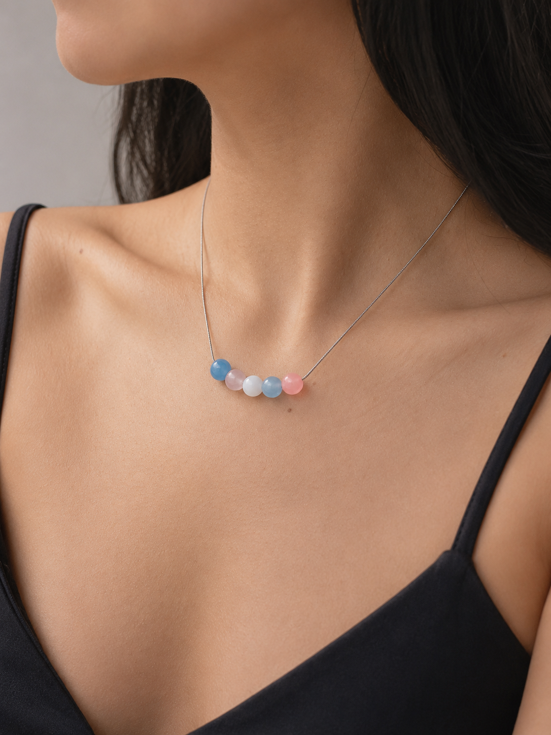 The Alignment Trans Pride Necklace worn around the neck — minimalist trans pride jewelry by LOUD SOULS