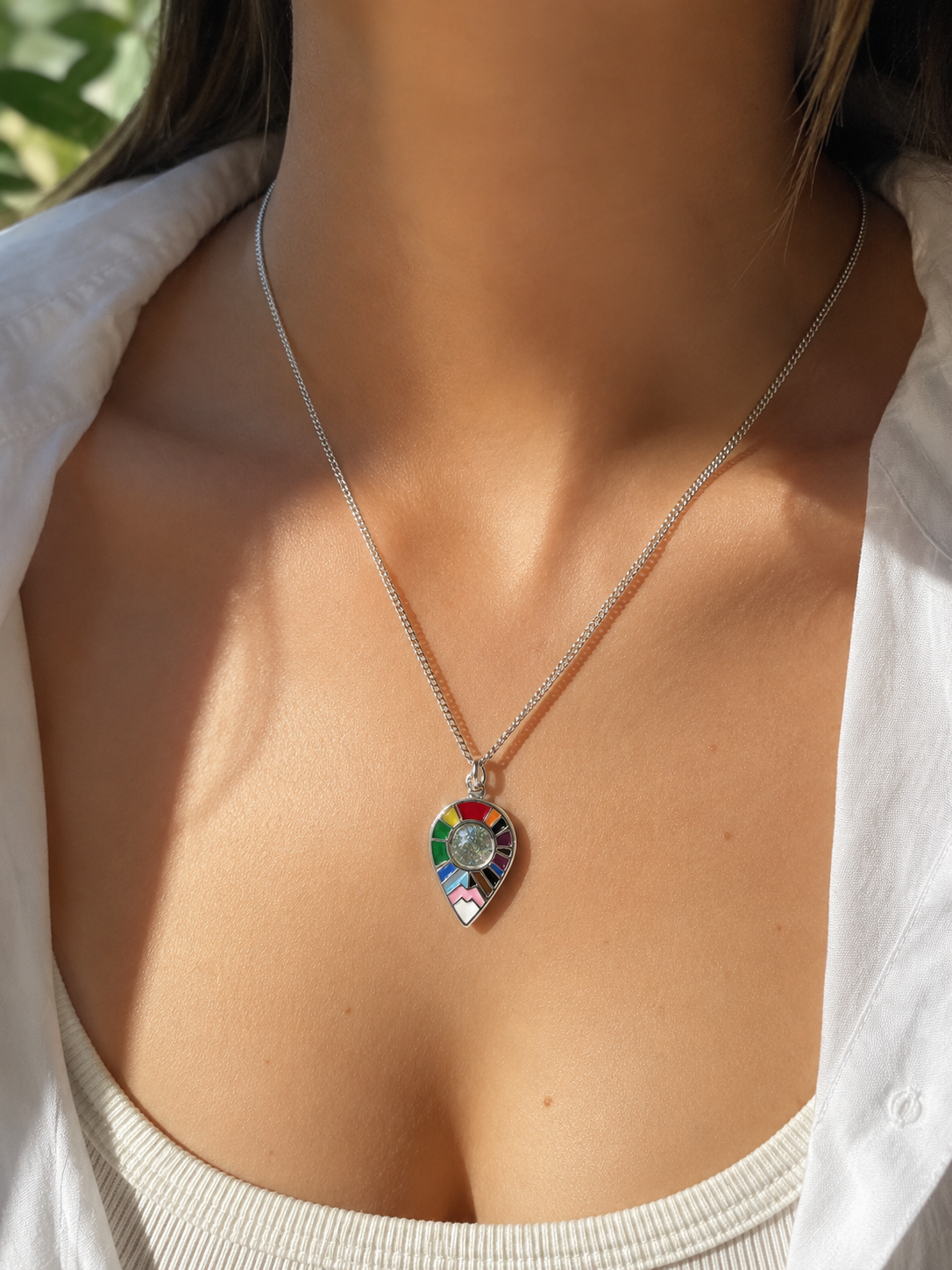 We Are Here Location Pendant worn around the neck — minimalist LGBTQ+ silver pride jewelry by LOUD SOULS